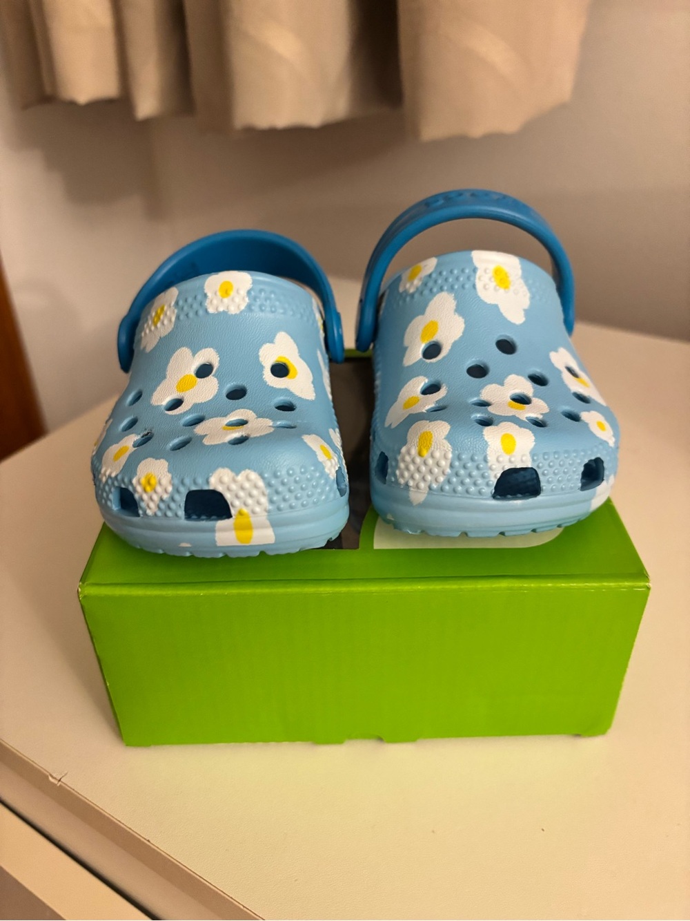 CROCS Kids Light Blue Floral Clogs with Yellow Centers